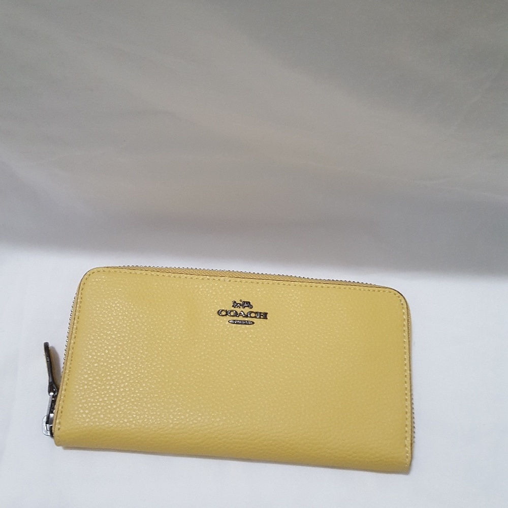 Authentic Coach Accordion zip wallet.